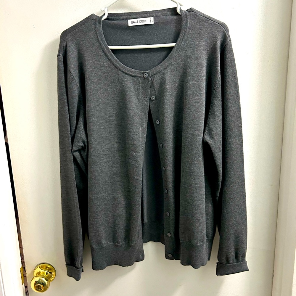 Long sleeve button up gray sweater. Great with a dress or jeans.